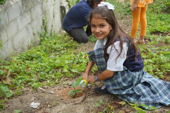 Girl planting in garden